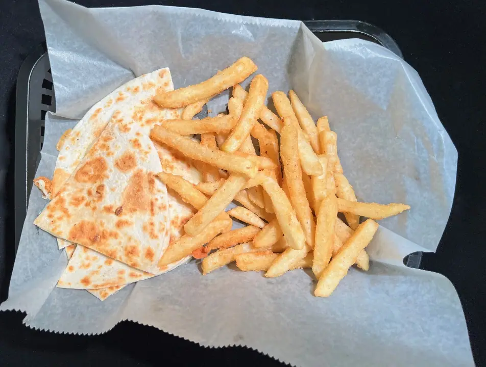 Me Gusta Queso: a cheese quesadilla with fries in a paper-lined basket.